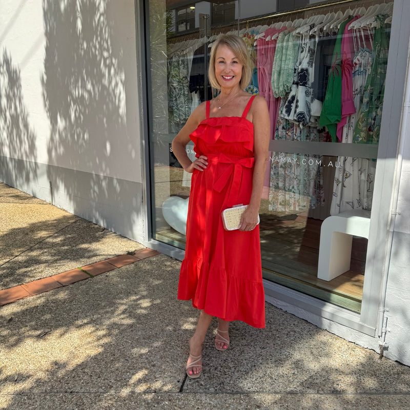 Our Vixen Frill Dress is so lovely. This red dress has frill accents on the bodice.