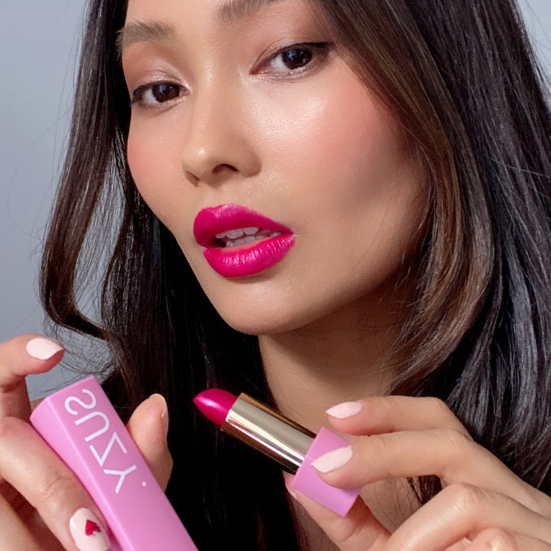 Suzy Carnation Lipstick with the bright pink packaging