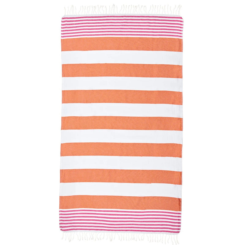 The turish towel has orange, white and pink stripes and features white tassels on the edge