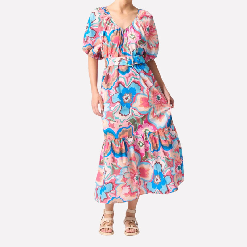 Dress being worn with the belt which cinches in at the waist.  The dress also has a frill hem and short sleeves.