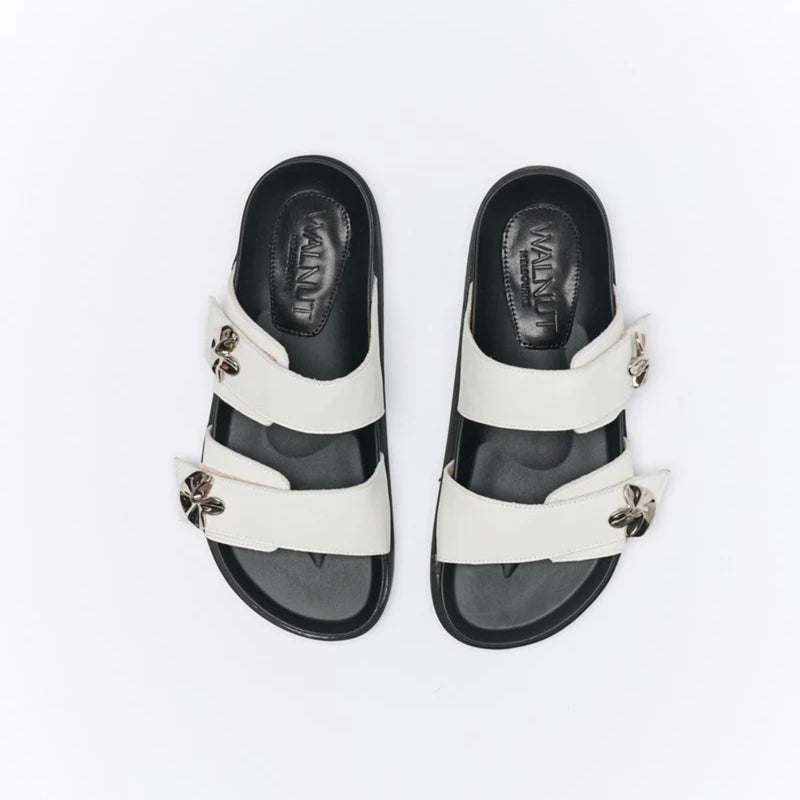 they have a moulded foot bed (black) and are an easy slip on style.