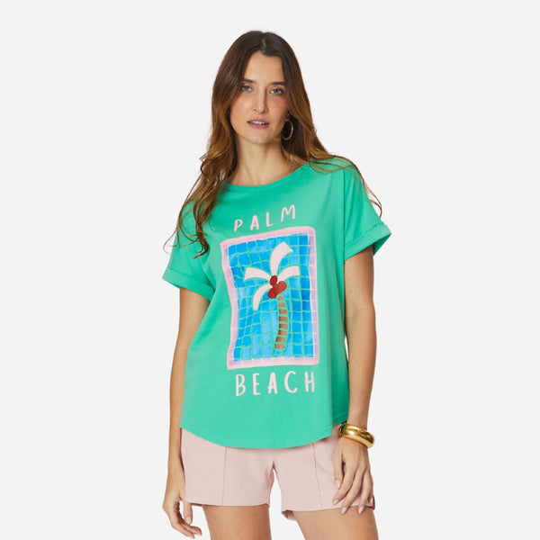 Jade Relaxed Tee with a Palm Beach print. This green tee by We Are The Others has a curved hem.