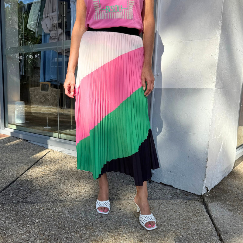 Our Lilian Pleat Skirt has a colourful diagonal pattern in white, pink, green and black.