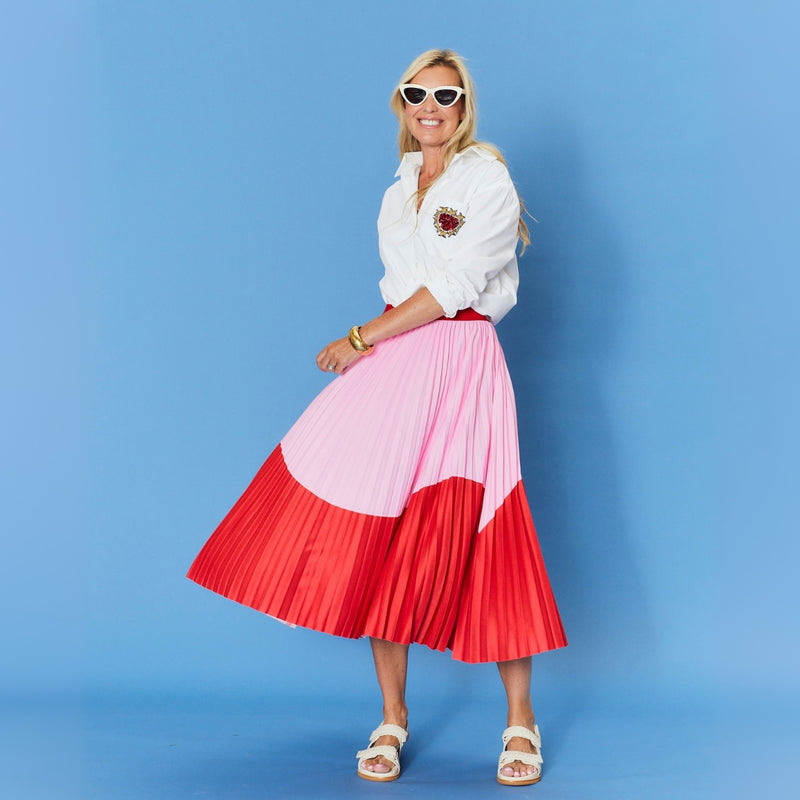 Full length view of the skirt being worn with the Chloe Shirt - featuring a  beaded heart emblem on the chest pocket.