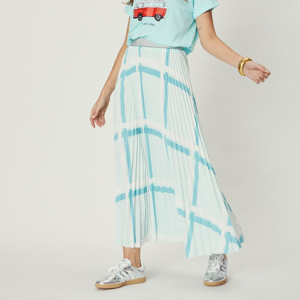 Our Simone Pleat Skirt is in a fab teal and white stripe print. This skirt has a silver metallic waistband and its maxi length.
