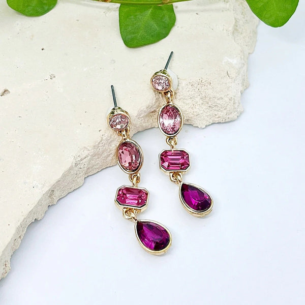 Our Abigail Jewel Earrings have different shaped stones in gradient shapes of rose pink.