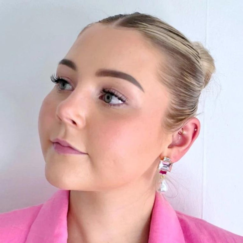 Model wearing our Carmen Jewel and Pearl Drop Earrings in Pink