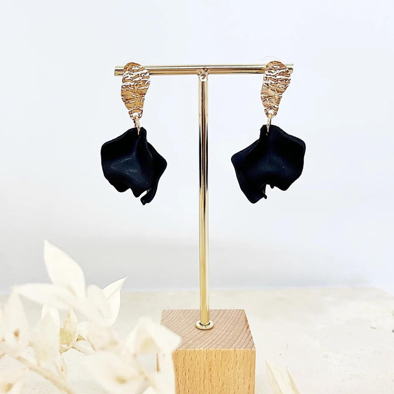 Fleur Petal Earrings in black suspended from a gold hammered stud