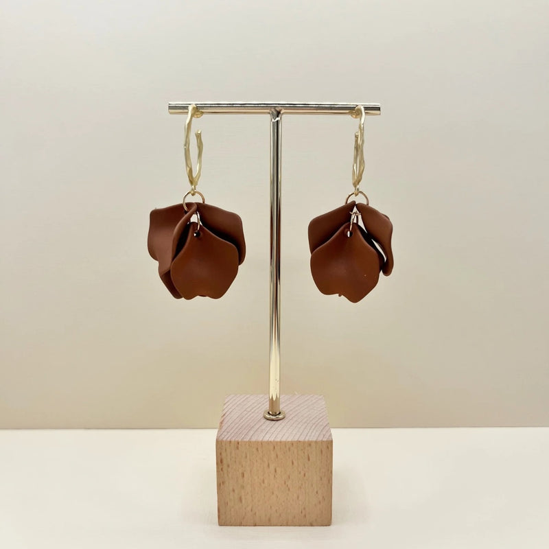 These gorgeous chocolate coloured petals are suspended from a textured gold hoop with stud back closure.