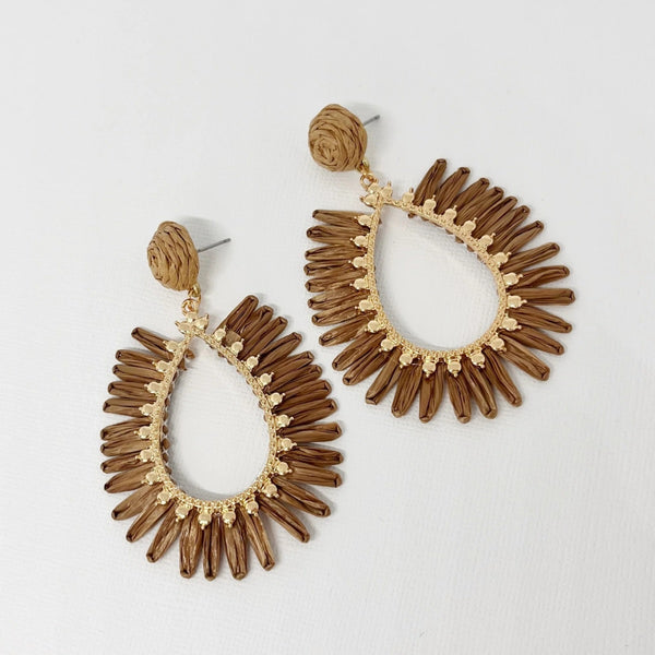 These teardrop shaped earrings have a coffee coloured raffia design.