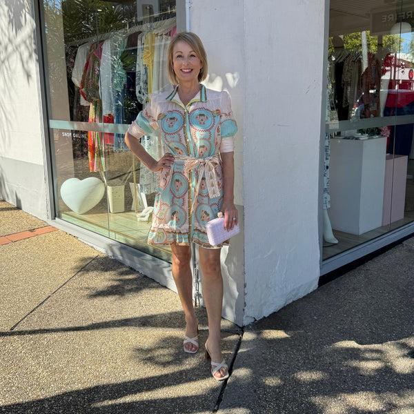 Our Acacia Mini Dress in an exclusive creamy pink and blue print.