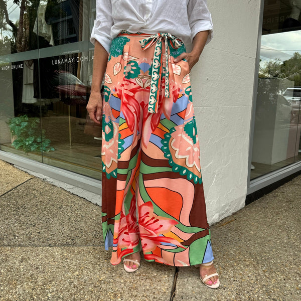 Our Lumina Palazzo Pants have a statement print in multi colours and a wide leg