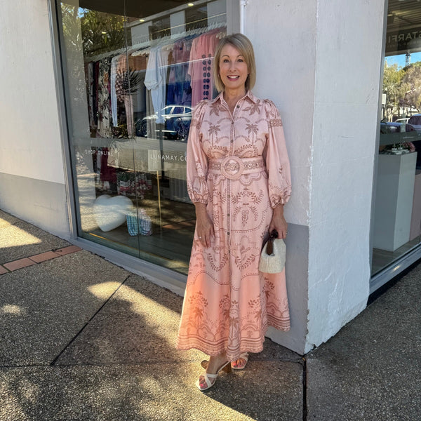 Features a collar, 3/4 length sleeves, detachable belt and an Aline maxi length skirt.