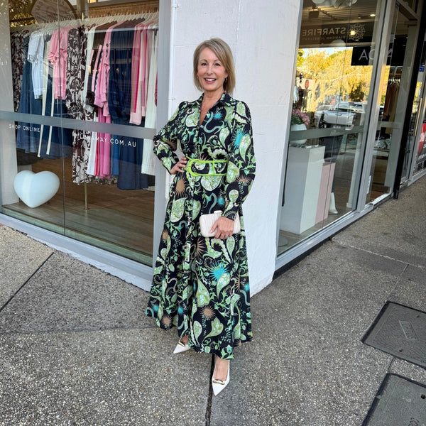 Our Zaria Maxi Dress has an exclusive 'midnight green' print. This shirt dress features a collar, button front, long sleeves and a maxi skirt.