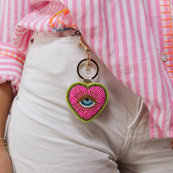 our Beaded Heart Eye Key Chain is super fun. Pink, green, gold and blue beads and it also features a gold clasp.
