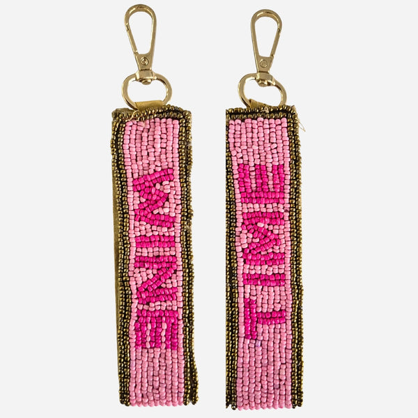 Beaded Wine Time Key Chain. It has pink and gold beads and features 'Wine' on one side the 'Time' on the other side.